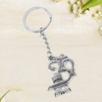 Om with Shivling Metal Keychain (1 Pc) - Closeup Embroidery by Nari Haat, Indian ethnic wear, women clothing, designe...