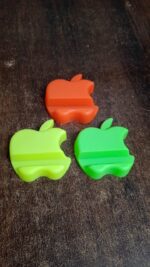 Apple-Shaped Plastic Mobile Phone Holder (1 pc & mix color) - Full Detail by Nari Haat, Indian ethnic wear, women clo...