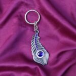 Elegant Metal Peacock Feather Keychain (1 Pc) - Neckline Detail by Nari Haat, Indian ethnic wear, women clothing, des...