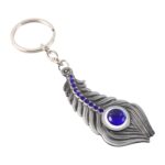 Elegant Metal Peacock Feather Keychain (1 Pc) - Sleeve Design by Nari Haat, Indian ethnic wear, women clothing, desig...