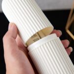 Capsule Shape Multipurpose Travel Storage Bottle - Closeup Embroidery by Nari Haat, Indian ethnic wear, women clothin...