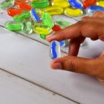 Glass Gem Stone, Flat Round Marbles Pebbles for Vase Fillers, Attractive pebbles for Aquarium Fish Tank. - Closeup Em...