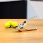 Stainless Steel Lemon Squeezer for Efficient Juice Extraction - Back View by Nari Haat, Indian ethnic wear, women clo...