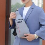 Waterproof Anti-Theft Crossbody Fanny Pack USB Charging & Earphone Hook (Grey/Blue) - Closeup Embroidery by Nari Haat...