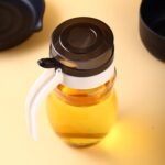 Plastic oil dispenser with small nozzle