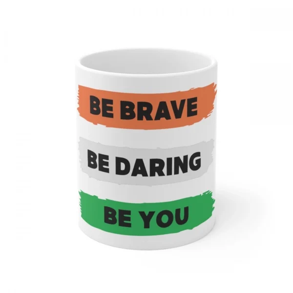 White ceramic coffee mug with 'Be Brave Be Daring Be You' quote