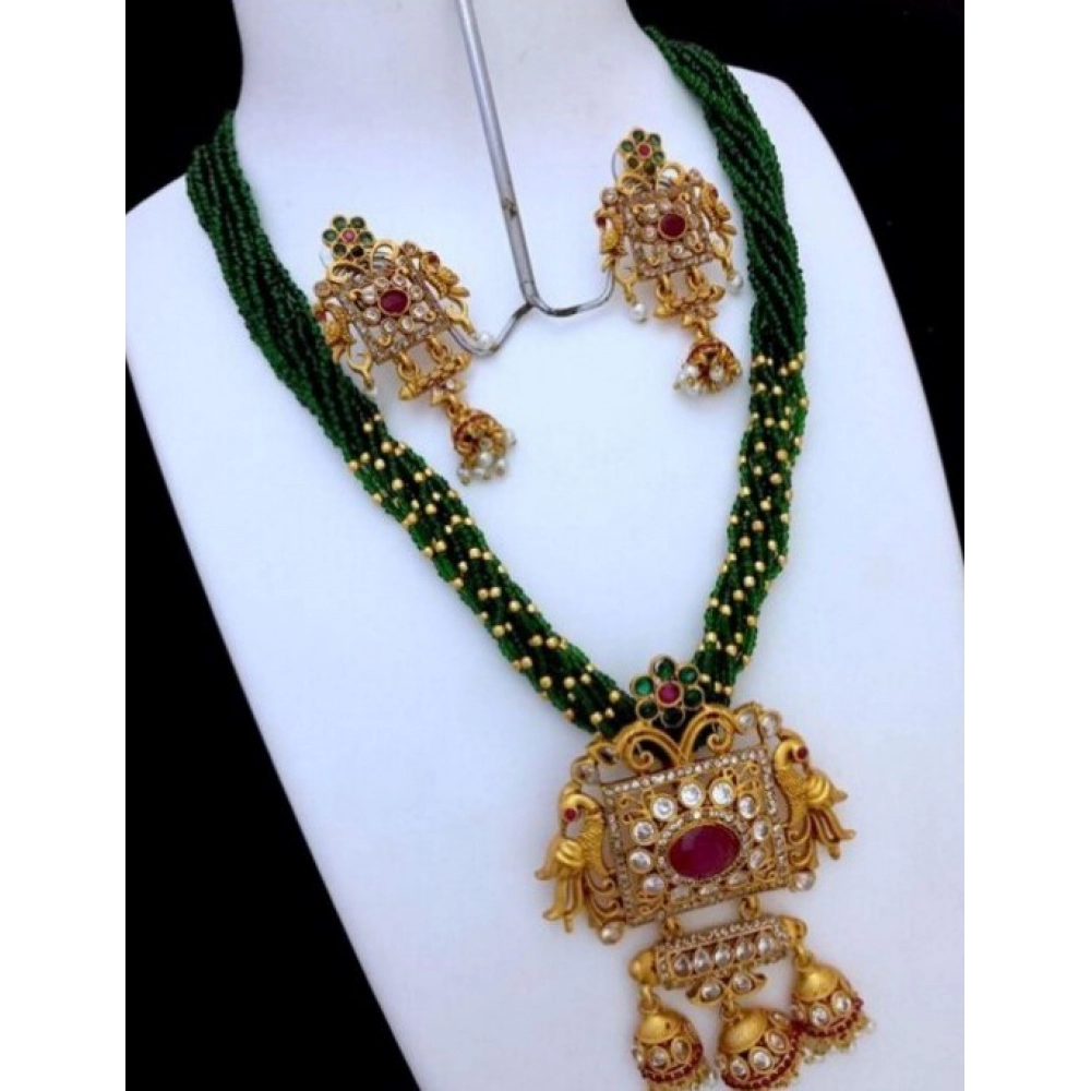 52904616670_328749d301_o_d-1000x1000-1.webp Women's Green Pearl American Diamond Pendant Jewellery Set - Front View by Nari Haat, Indian ethnic wear, women cloth...