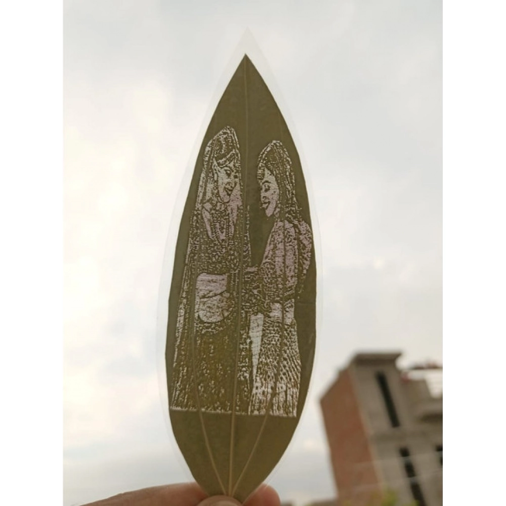 Engraved bride and bridesmaid portrait on a natural leaf