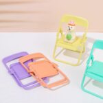 Chair-Shaped Mobile Stand – Stylish Phone Holder for Home & Office Use (1 Pc) - Full Detail by Nari Haat, Indian et...