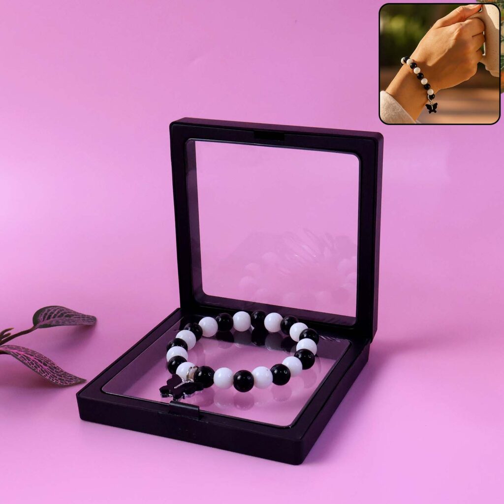 Elegant Black and White Beaded Bracelet with Cross Pendant