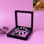 Elegant Black and White Beaded Bracelet with Cross Pendant