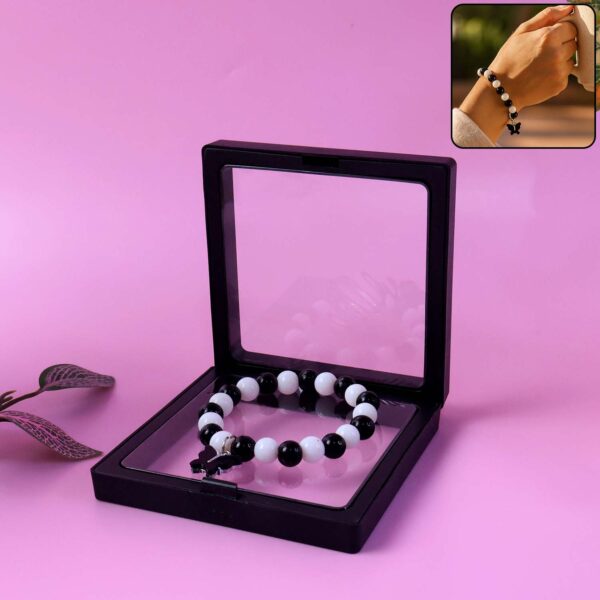 Elegant Black and White Beaded Bracelet with Cross Pendant